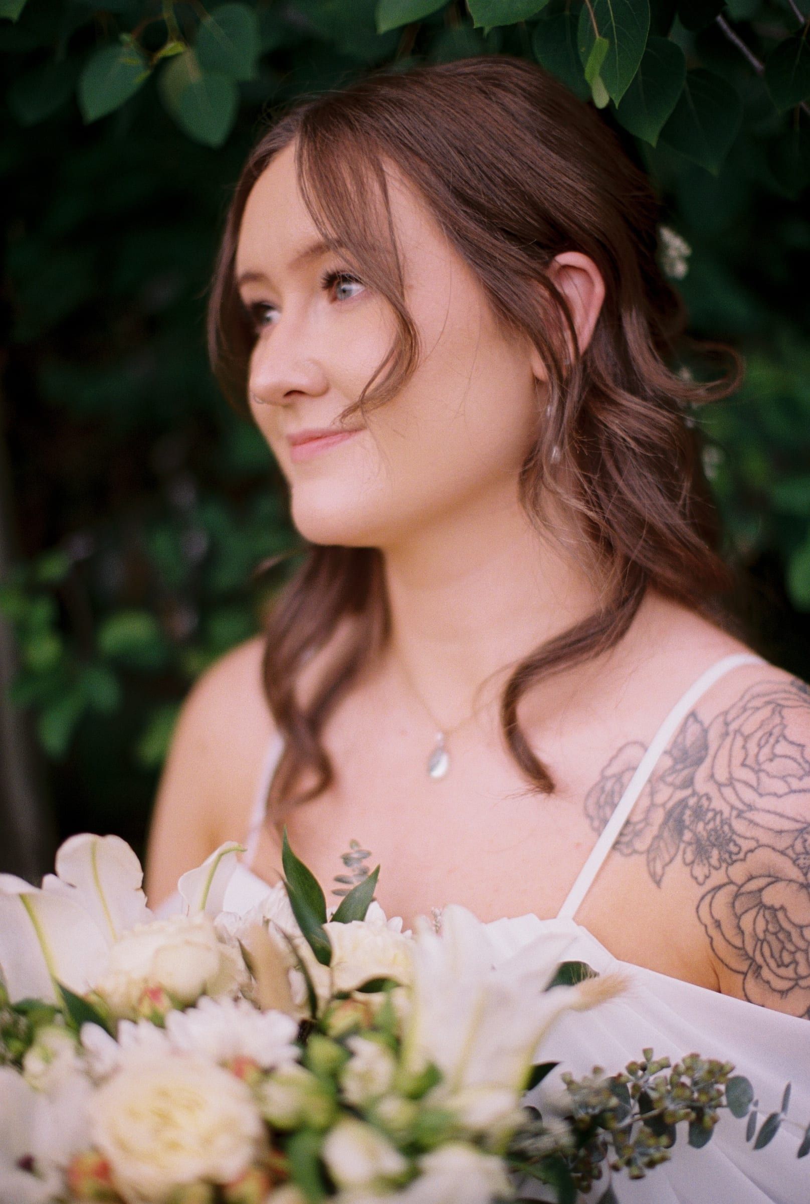 Guests raising champagne flutes for a garden wedding toast