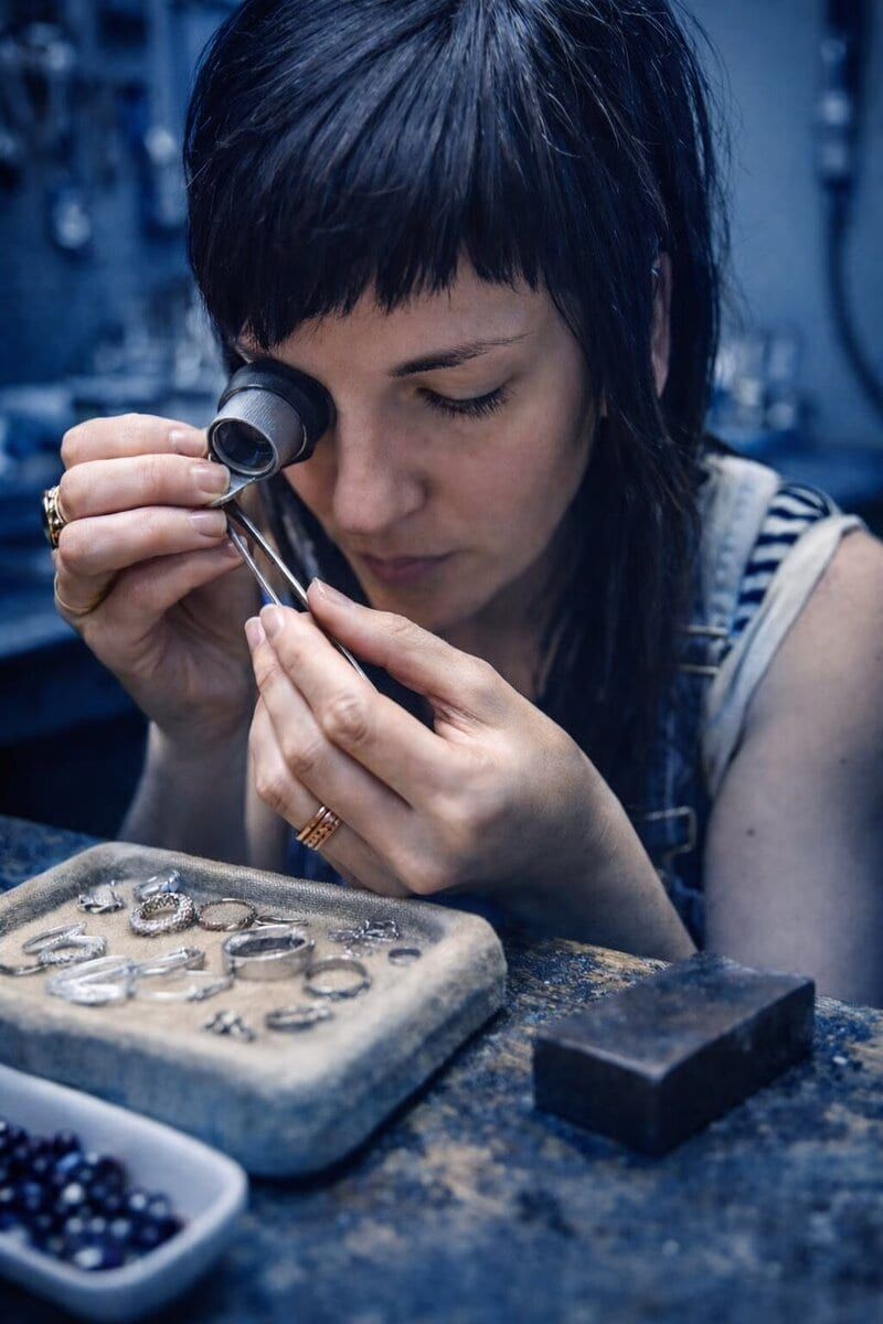 Blackbird Jewellers goldsmith inspecting rings through a loupe