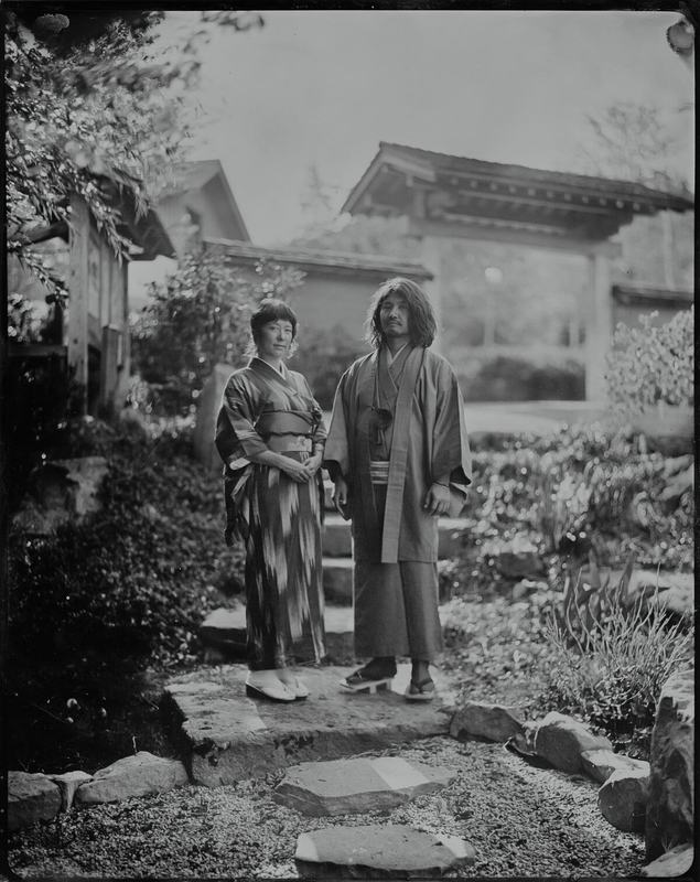 Couple wearing kimono in a Japanese garden, tintype