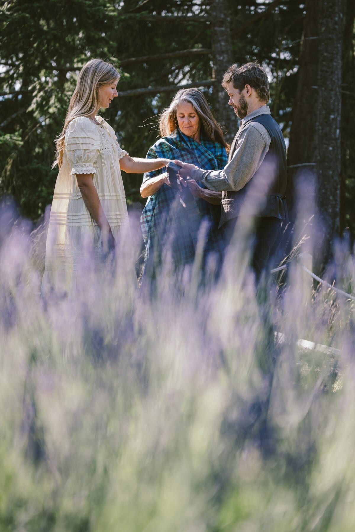 Handfasting ceremony above the lavender rows at a Salt Spring Island micro wedding