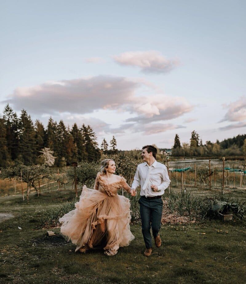 Vancouver Island Elopements couple dashing through a sunset farm garden