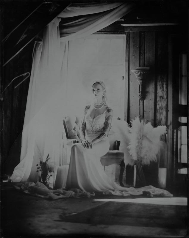 Seated bride in a draped attic room, wet-plate portrait