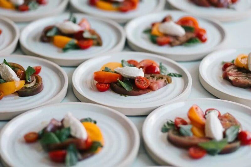 Heirloom tomato appetizer plates by Mensch Kitchen & Catering