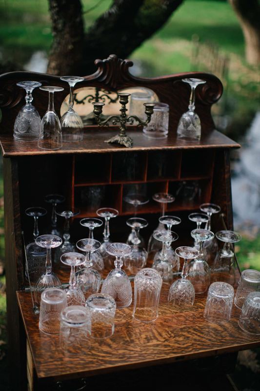 Antique oak cabinet brimming with vintage crystal glassware